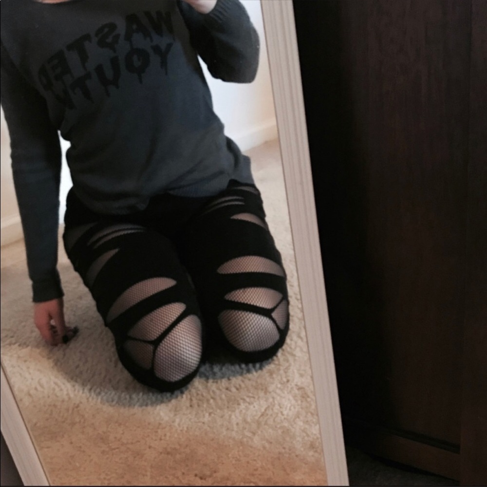 Fishnet slashed leggings